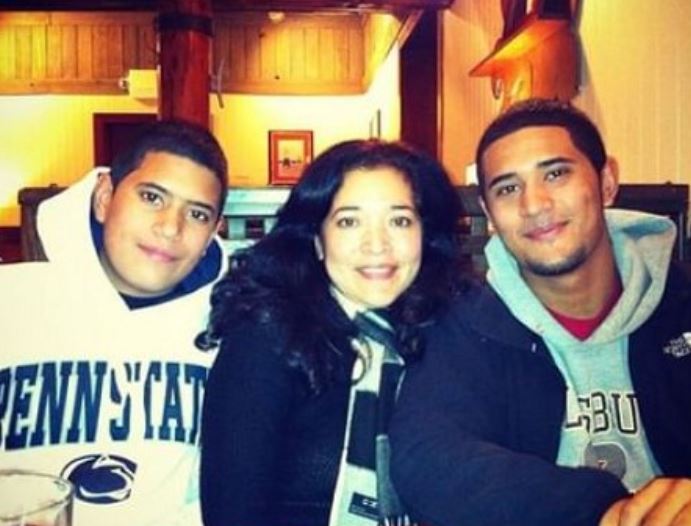 Kevin Mejia with his mother and brother